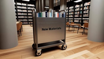A cart labled "New Materials" sitting in a modern library.