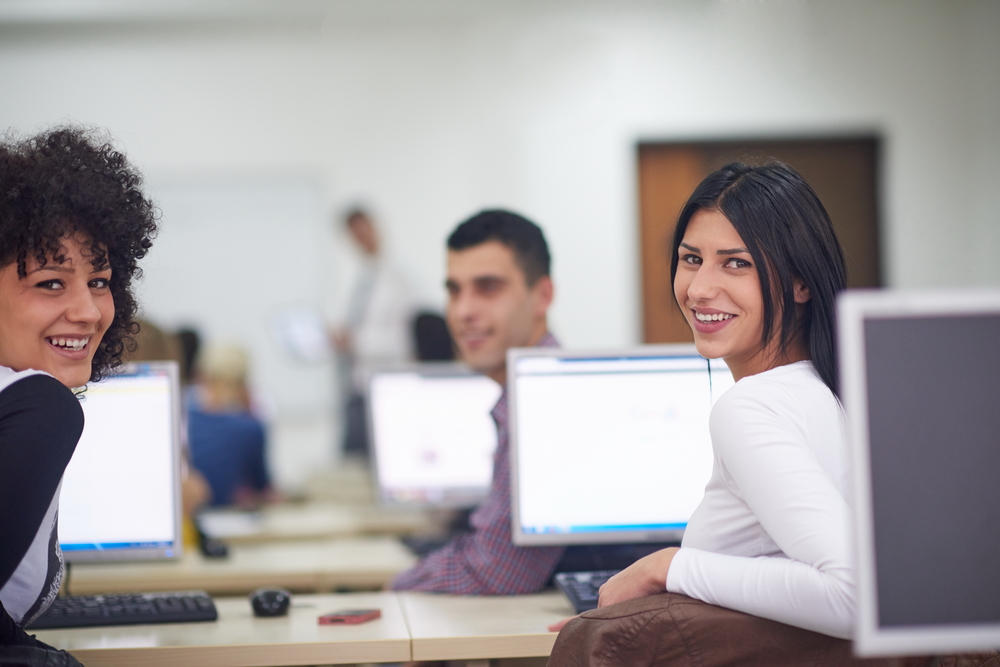 technology students group in computer lab classroom