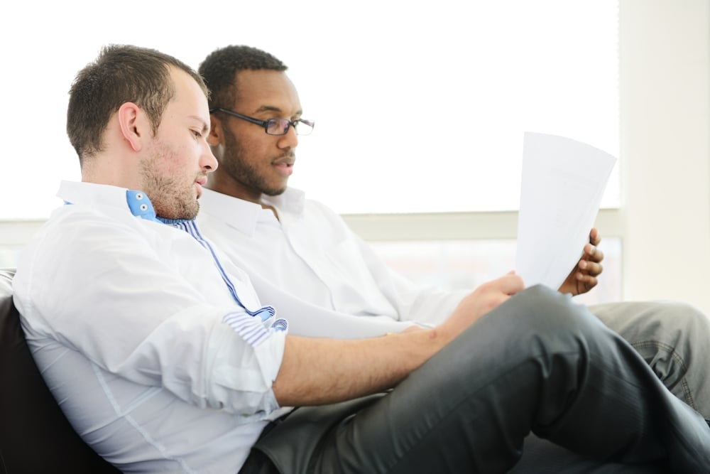 Two architects at work discussing a project