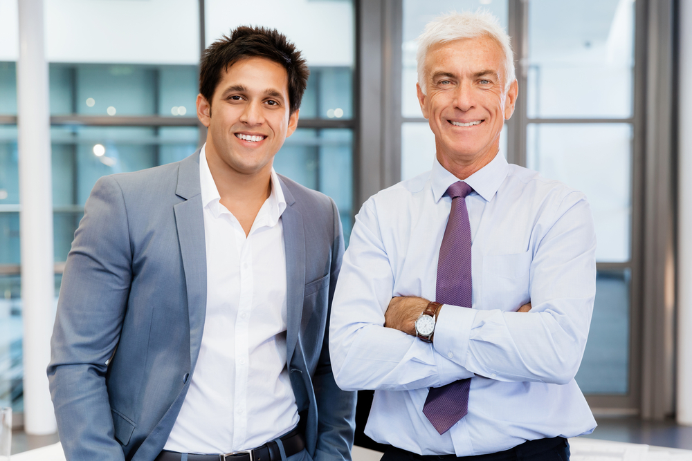 Two businessmen in office standing