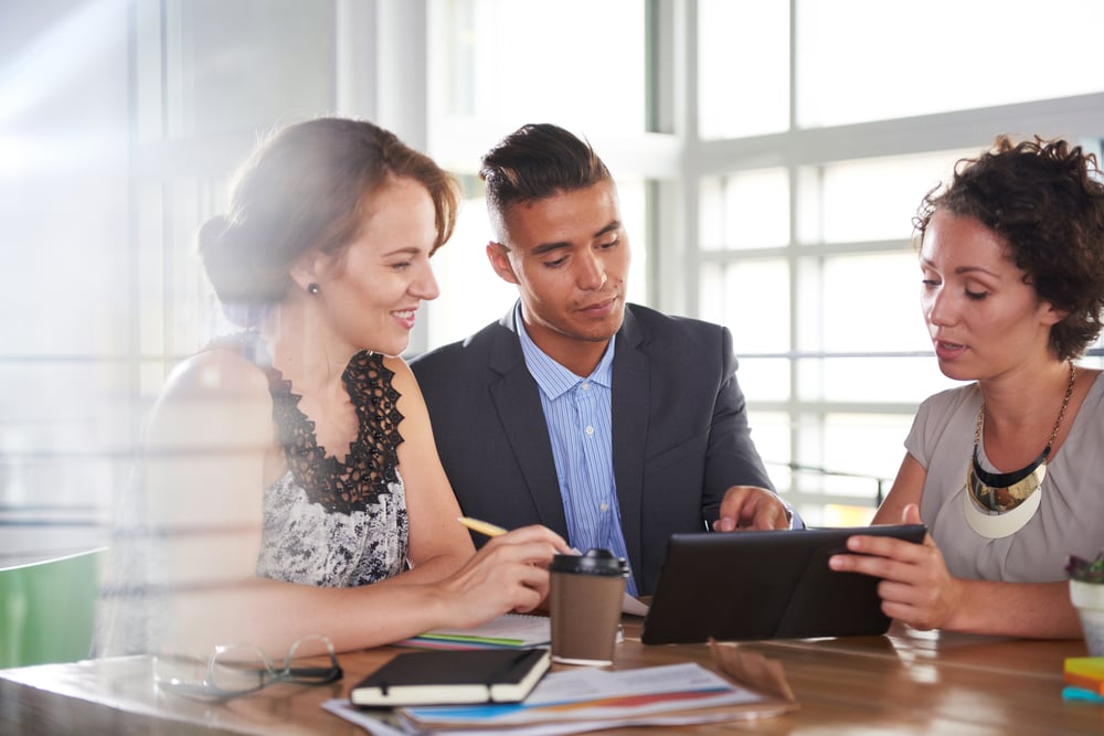 team of successful business people having a meeting in executive sunlit office-1